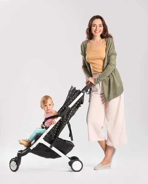 Woman Her Cute Baby Stroller Light Background — Stock Photo, Image