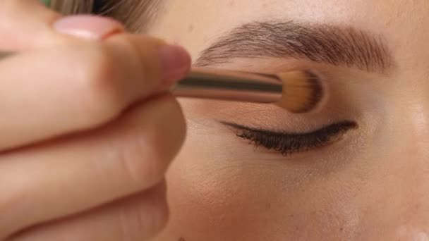 Beautiful Young Woman Applying Eyeshadows Closeup — Stock Video