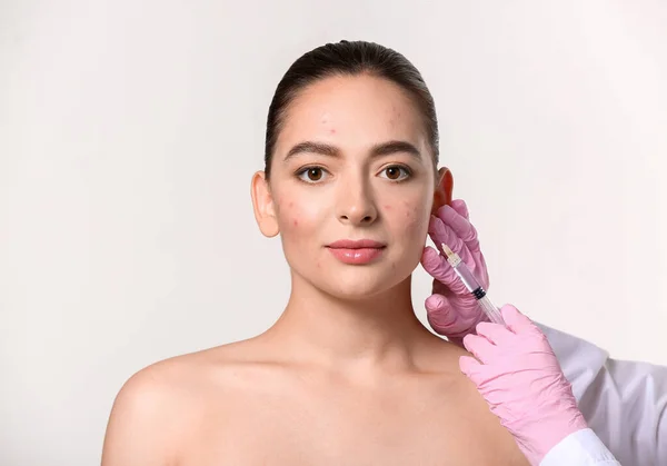 Young Woman Acne Problem Receiving Injection Her Face Light Background — Stock Photo, Image