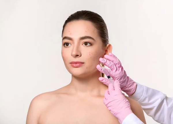 Young Woman Acne Problem Receiving Injection Her Face Light Background — Stock Photo, Image