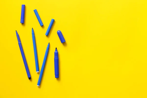 Felt-tip pens on color background