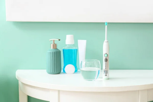 Set for oral hygiene on table in bathroom