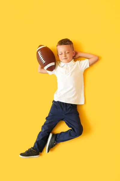 Little Boy Rugby Ball Color Background Top View — Stock Photo, Image