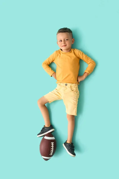 Kleiner Junge Mit Rugby Ball Auf Farbigem Hintergrund Draufsicht — Stockfoto