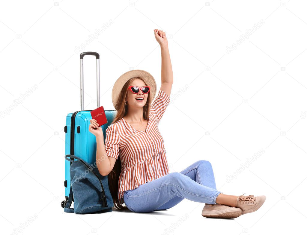 Young woman with luggage on white background. Travel concept