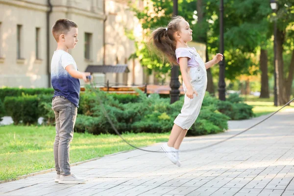 Cute Little Children Jumping Rope Outdoors — Stock Photo, Image