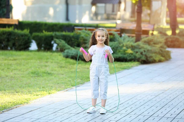Cute Little Girl Jumping Rope Outdoors — Stock Photo, Image