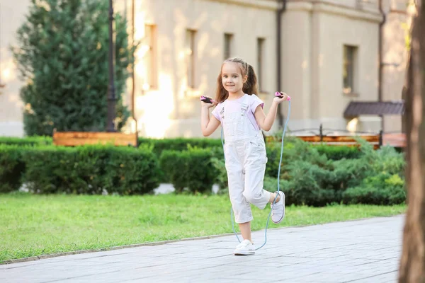 Cute Little Girl Jumping Rope Outdoors — Stock Photo, Image