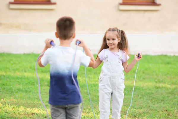 Cute Little Children Jumping Rope Outdoors — Stock Photo, Image