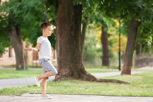 Cute Little Boy Jumping Rope Outdoors — Stock Photo, Image