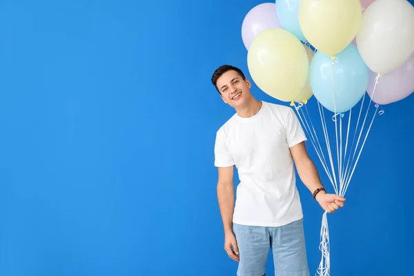 Young Man Balloons Color Background — Stock Photo, Image