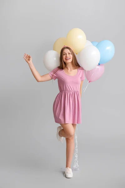 Young Woman Balloons Grey Background — Stock Photo, Image