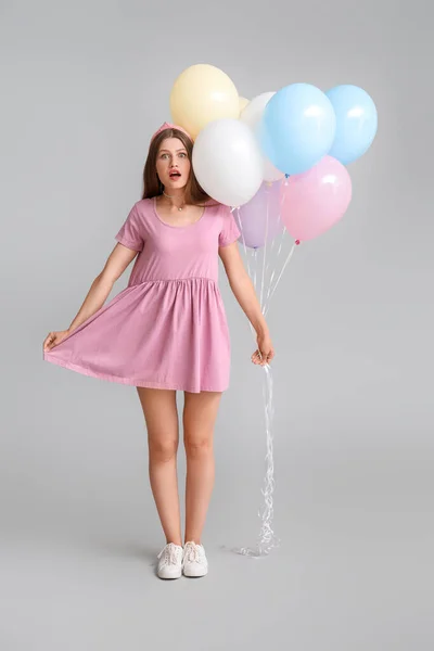 Surprised Young Woman Balloons Grey Background — Stock Photo, Image