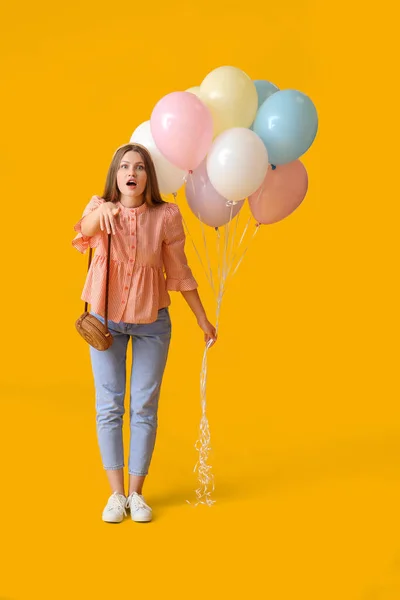 Surprised Young Woman Balloons Color Background — Stock Photo, Image