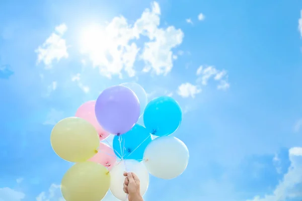 Woman with beautiful balloons outdoors