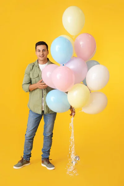 Young Man Balloons Color Background — Stock Photo, Image