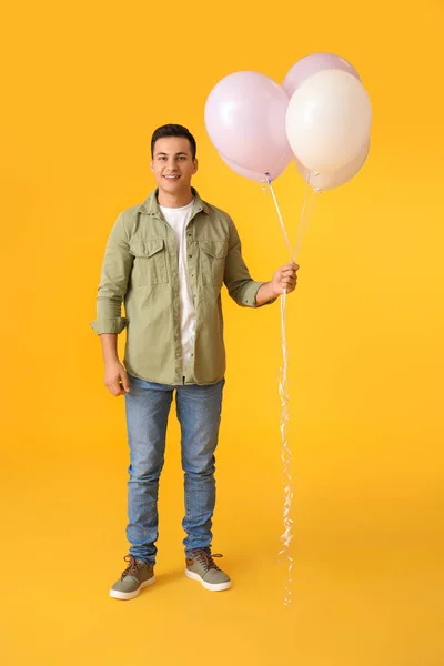 Young Man Balloons Color Background — Stock Photo, Image