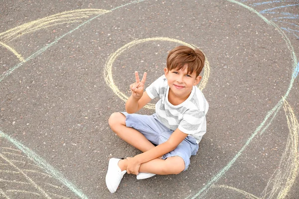 Little Boy Sitting Chalk Drawing Rocket Outdoors — Stock Photo, Image