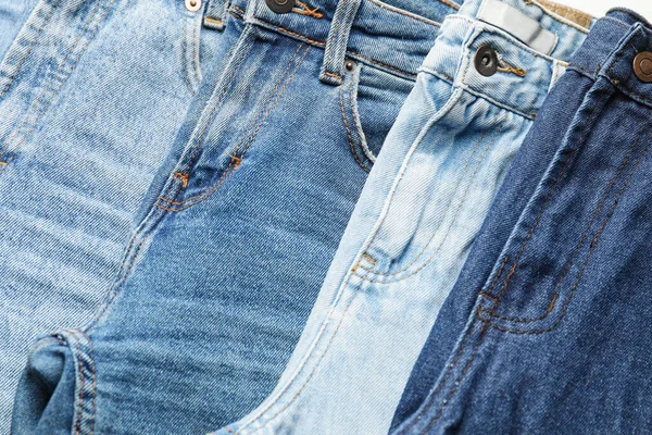 Molti Jeans Alla Moda Come Sfondo — Foto Stock