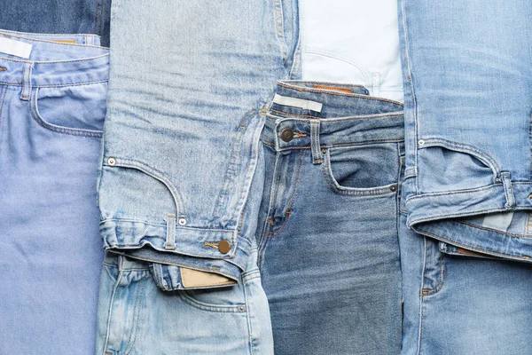 Viele Stylische Jeans Als Hintergrund — Stockfoto