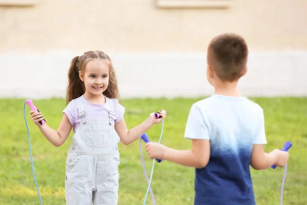 Cute Little Children Jumping Rope Outdoors — Stock Photo, Image