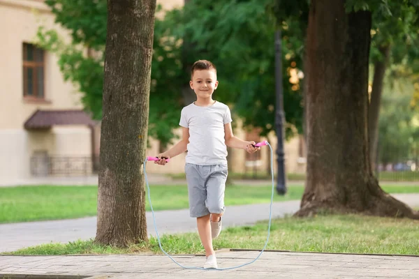 Cute Little Boy Jumping Rope Outdoors — Stock Photo, Image
