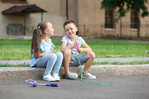 Cute Little Children Jumping Ropes Outdoors — Stock Photo, Image