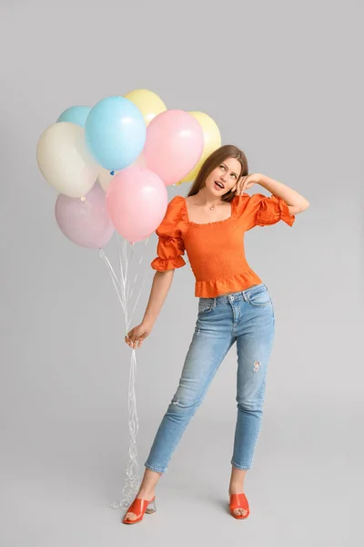 Young Woman Balloons Grey Background — Stock Photo, Image