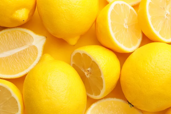 Many ripe lemons as background