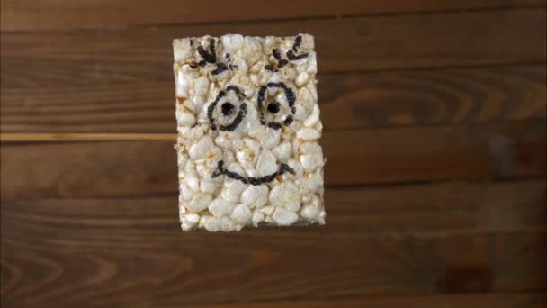 Stop Motion Video Crispy Rice Bar Wooden Background — Stock Video