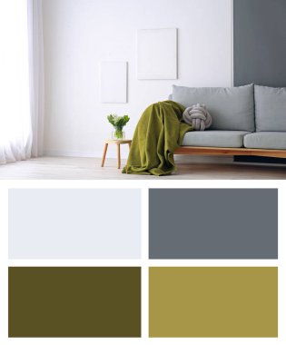 Oturma odasının duvarına yakın şık bir kanepe. Farklı renk desenleri