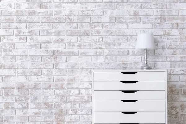 Modern Chest Drawers Lamp Brick Wall Room — Stock Photo, Image