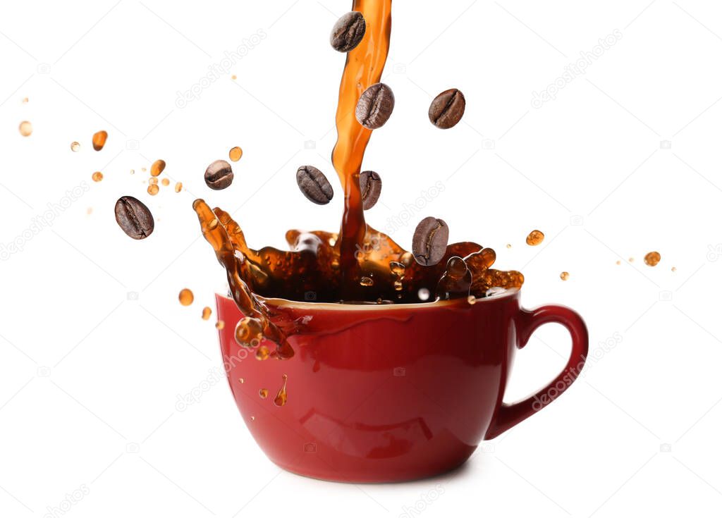 Pouring of hot coffee in cup and falling beans on white background