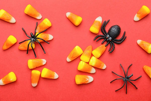 色の背景にハロウィーンやクモのためのおいしいキャンディー — ストック写真