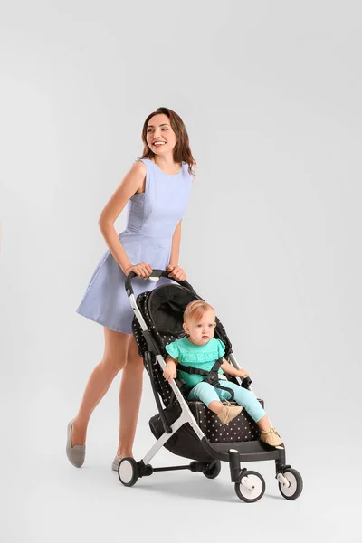 Woman Her Cute Baby Stroller Light Background — Stock Photo, Image