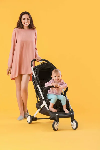 Woman Her Cute Baby Stroller Color Background — Stock Photo, Image