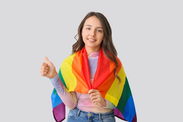 Young Woman Lgbt Flag Showing Thumb Light Background — Stock Photo, Image