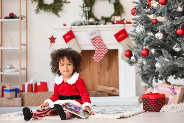 Cute African American Girl Santa Costume Reading Book Home Christmas — Stock Photo, Image