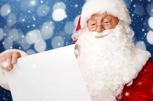 Santa Claus Reading Wish List Color Background — Stock Photo, Image