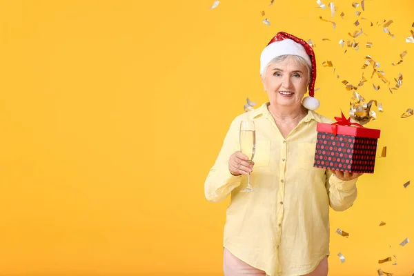 Elderly Woman Christmas Gift Champagne Color Background — Stock Photo, Image
