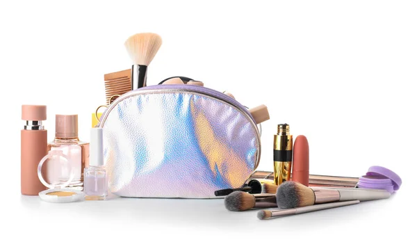 Makeup bag with decorative cosmetics on white background