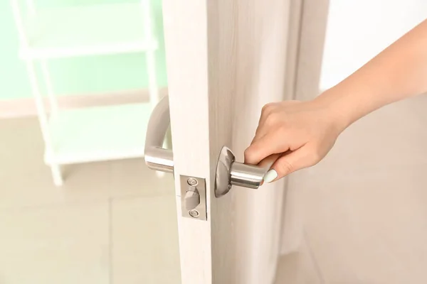 Woman Opening Door Indoors Closeup — Stock Photo, Image