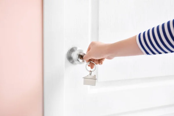 Woman Using Key Open Door Indoors — Stock Photo, Image