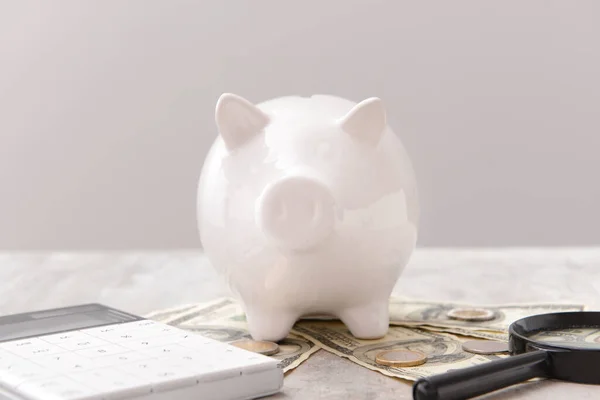 Piggy Bank Money Calculator Magnifier Grey Background Concept Pension — Stock Photo, Image