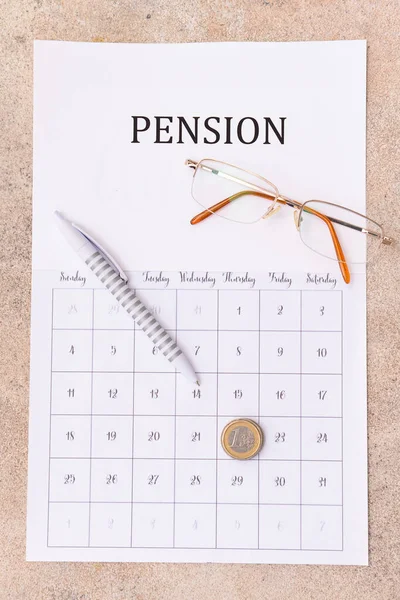 Calendar Coins Eyeglasses Pen Grey Background Concept Pension — Stock Photo, Image