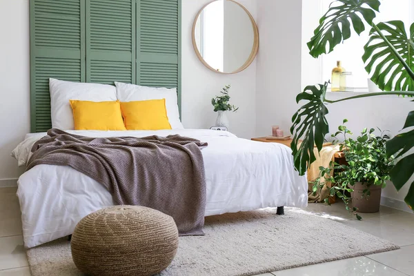 Interior of modern stylish bedroom with mirror