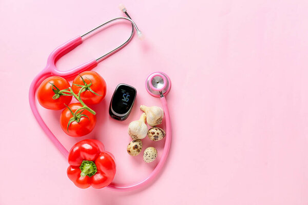 Vegetables, stethoscope and glucometer on color background. Diabetes concept