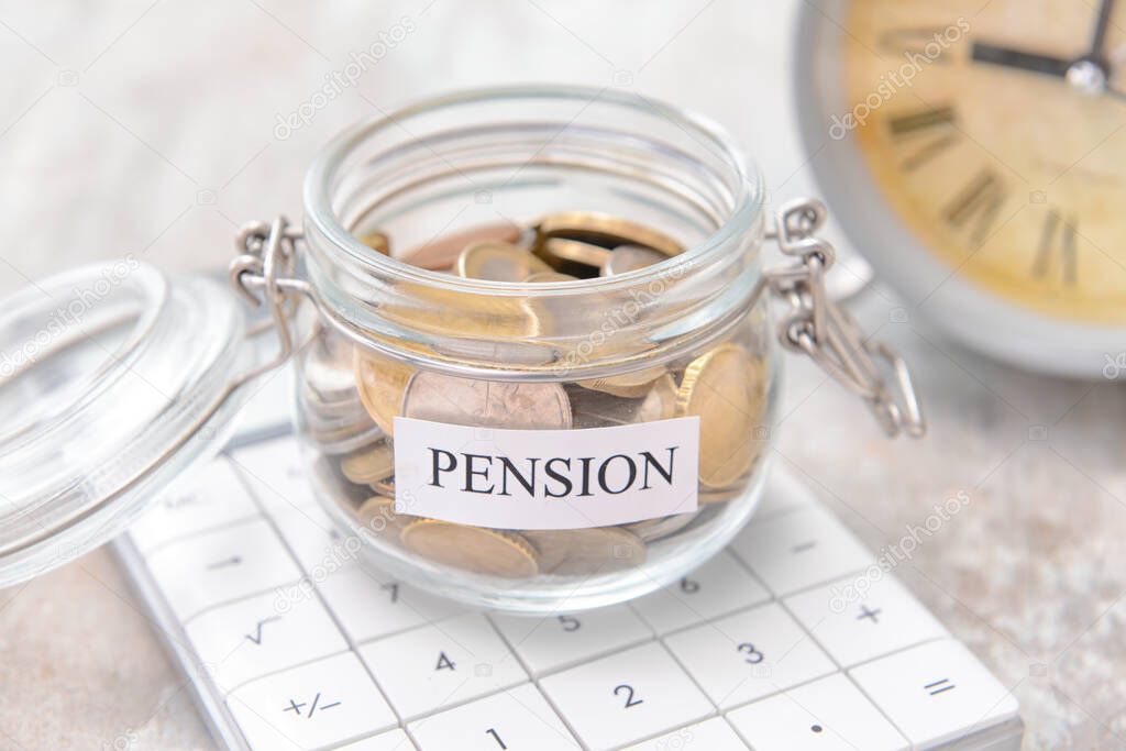 Jar with savings and calculator on grey background, closeup. Concept of pension