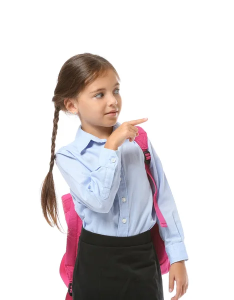 Pequeña Colegiala Señalando Algo Sobre Fondo Blanco —  Fotos de Stock