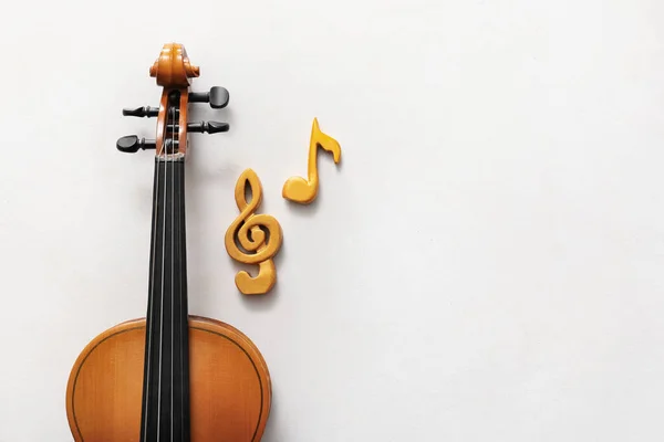 Violin with music notes on white background
